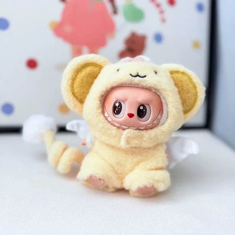 Labubu wearing a dreamy angel outfit with a fluffy yellow bodysuit, white wings, and big round ears.