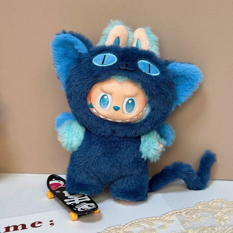 Labubu wearing an ocean dragon outfit with a dark blue bodysuit, a tail, and a detailed dragon hood.