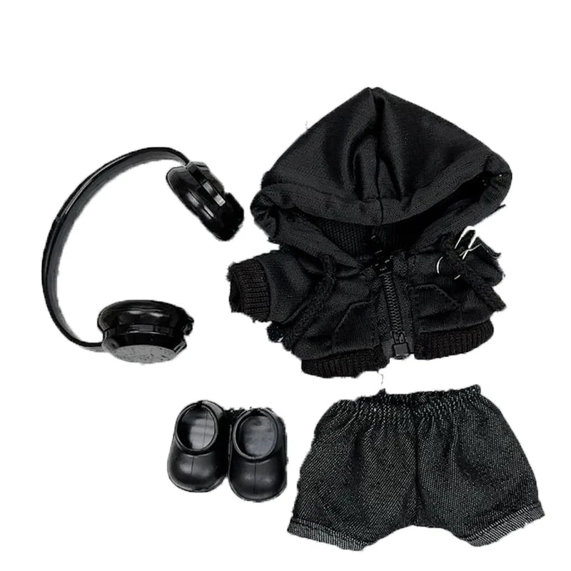 Close-up of Labubu wearing a black hoodie with a zipper and safety pin details.
